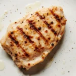 6 oz chicken breast cooked and plated showing a standard high-protein portion